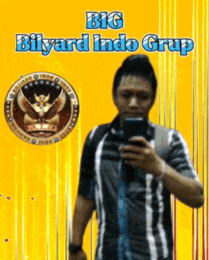 a man taking a selfie in front of a big bilyard indo grup sign
