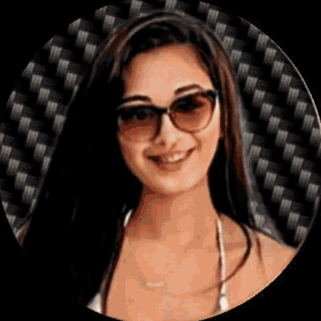 a woman wearing sunglasses and a bikini top is in a circle .