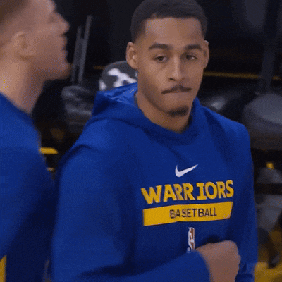 a man wearing a blue nike warriors sweatshirt