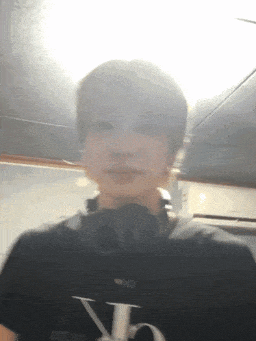 a blurry picture of a person wearing a black shirt with the letters ck on it