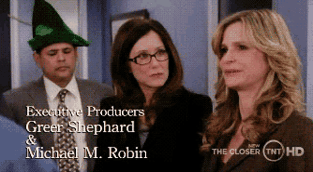 executive producers greer shephard and michael m. robin are shown on a screen