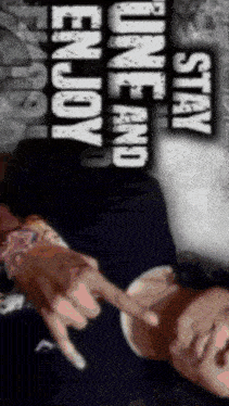 a man laying down with the words " stay one and enjoy " above him