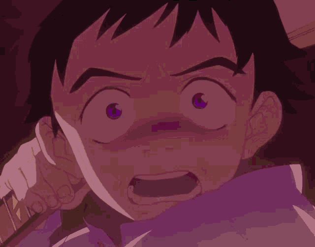 a close up of a person 's face with a surprised look on their face