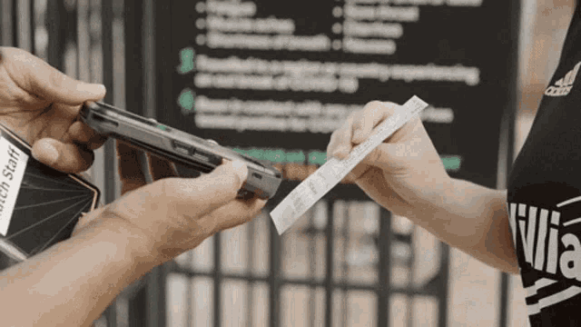 a person holding a receipt that says " health staff "