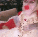 a close up of a person wearing a white dress with red lips .