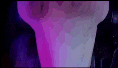 a close up of a purple and blue light