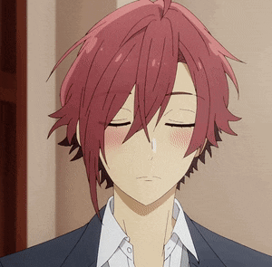 a close up of a person 's face with red hair and closed eyes .