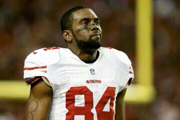 a man wearing a 49ers jersey with the number 84 on it