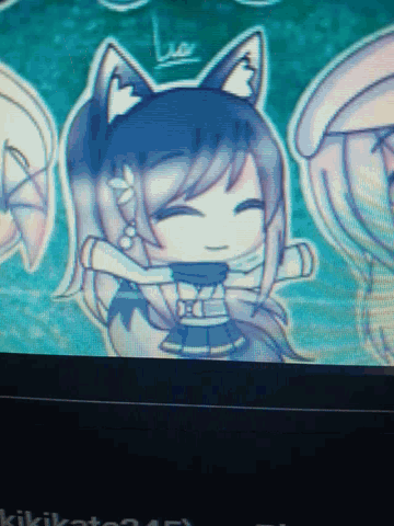 a computer screen displays a drawing of a cat