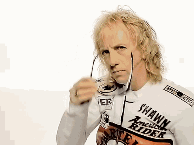 a man wearing a white harley davidson jacket