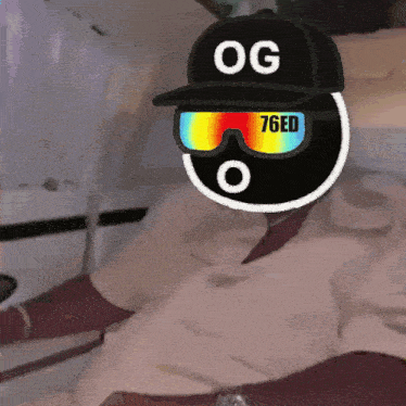 a person wearing a hat that says og 76ed on it