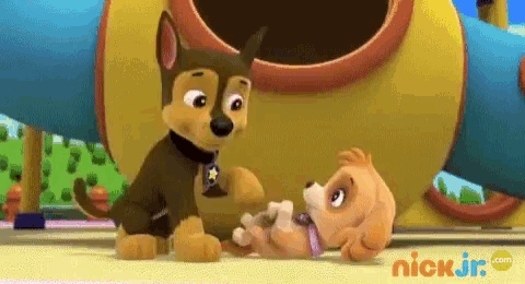 chase and skye from paw patrol are standing next to each other in front of a playground .