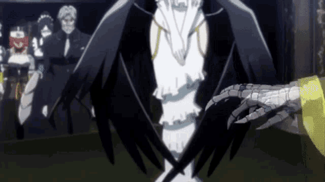 a skeleton hand is holding a woman 's hand in front of a crowd of people .