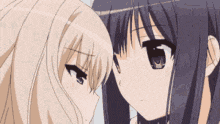 two anime girls are touching their foreheads and looking at each other .