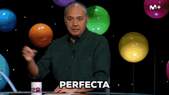 a man in a green shirt says perfecta in front of balloons and a m + logo