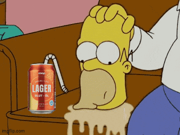 homer simpson is sitting on a couch drinking from a can of lager