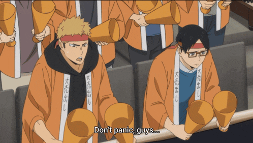 a group of people holding megaphones and one of them says " don 't panic guys "