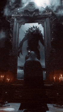 a man in a black cape stands in front of a mirror