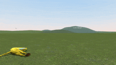 a person 's foot is visible on a yellow object in a field