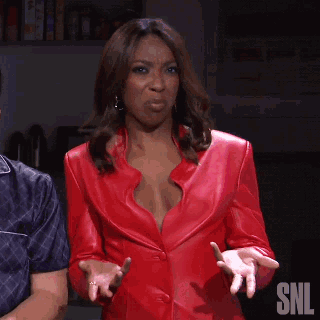 a woman in a red leather jacket with snl on the bottom right