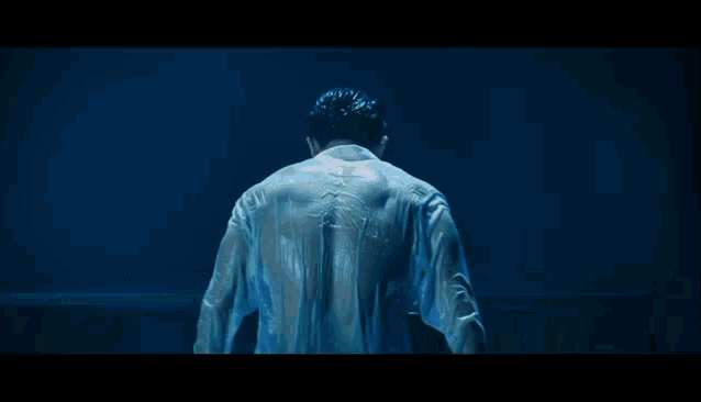 a man 's back is shown in a painting with a blue background