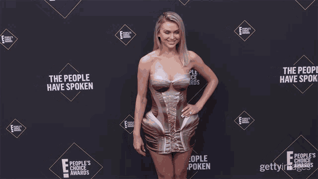 a woman on a red carpet with the words the people have spoken on it