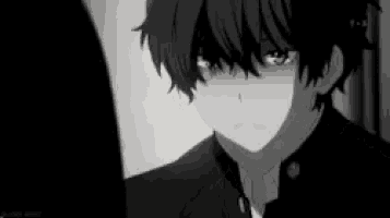 a black and white photo of a boy with green eyes and a suit .