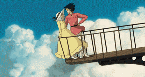 a man in a red shirt and a woman in a yellow dress are standing on a bridge in the sky .