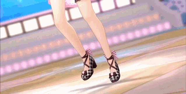 a close up of a person 's legs wearing a pair of high heels