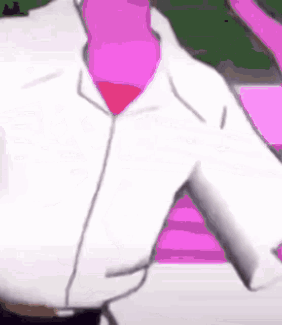a man wearing a white shirt and a pink tie .