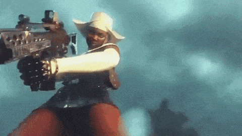 a woman in a cowboy hat is pointing a gun