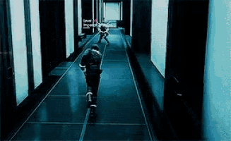 a man is running down a hallway in a video game