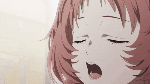 a close up of a girl with her eyes closed and her mouth open