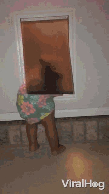 Peeking Through Dog Door Viralhog GIF - Peeking Through Dog Door Viralhog Coming Out Through The Dog Door GIFs