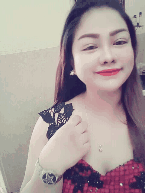 a woman wearing a watch has a star on the face