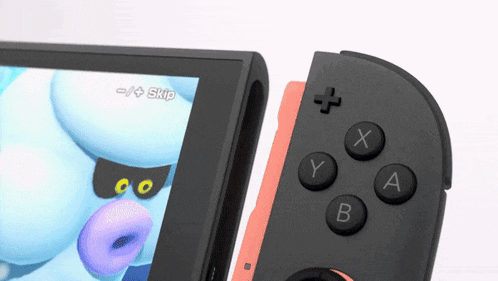 a nintendo switch with a game on the screen and a controller next to it
