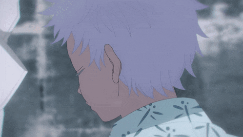 a close up of a person with blue eyes and white hair