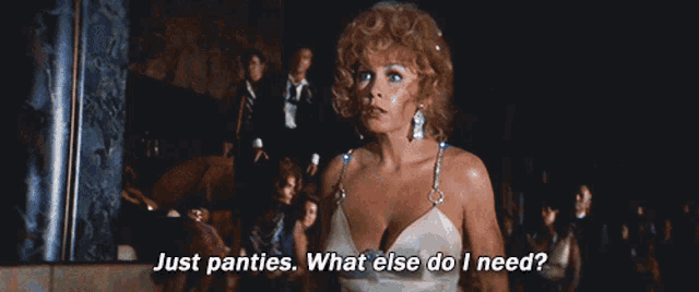 a woman in a white dress is saying " just panties what else do i need "