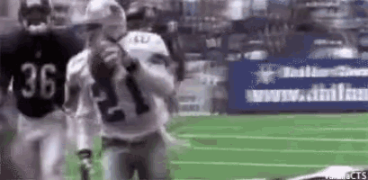 a football player with the number 36 on his jersey is holding a football