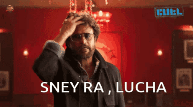 a man wearing sunglasses and a black jacket says " sney ra lucha "