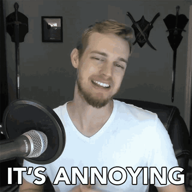 a man in front of a microphone with the words it 's annoying below him