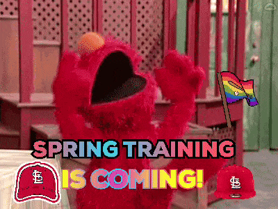 elmo says spring training is coming with a baseball cap