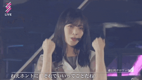 a woman is dancing in front of a sign that says " live "