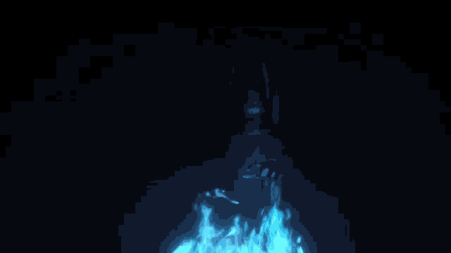a blue flame is coming out of a black background .