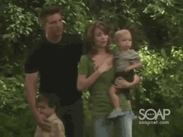 a family standing next to each other with soapnet.com in the upper right corner