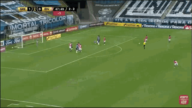 a soccer player in a pink shirt is running on the field .