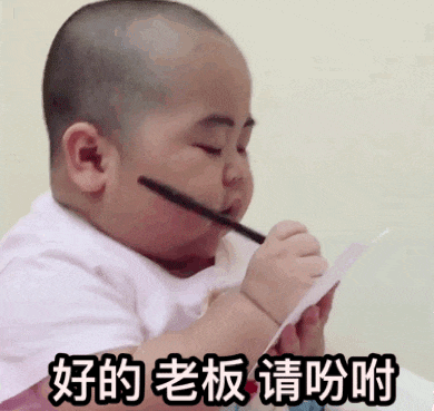 a baby is holding a pencil in his mouth and writing on a piece of paper ..