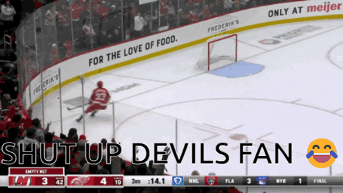 a hockey game with the words shut up devils fan on the top