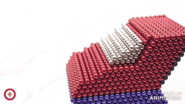 red white and blue beads are stacked on top of each other with the words made in animotica on the bottom right