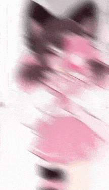 a blurry picture of a pink cat 's face on a white background .
